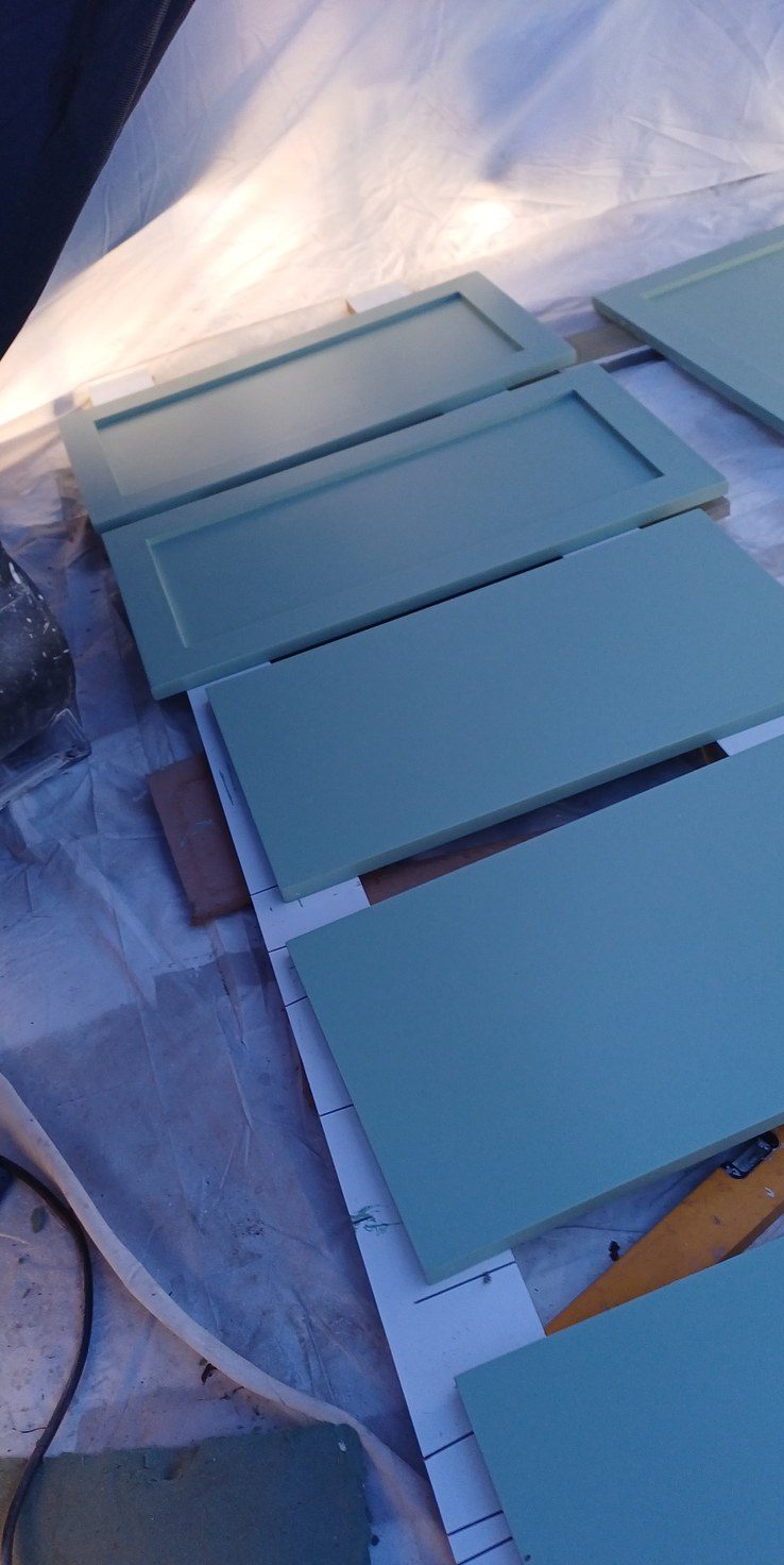 The same doors after spraying, in the new colour, ready to rehang.